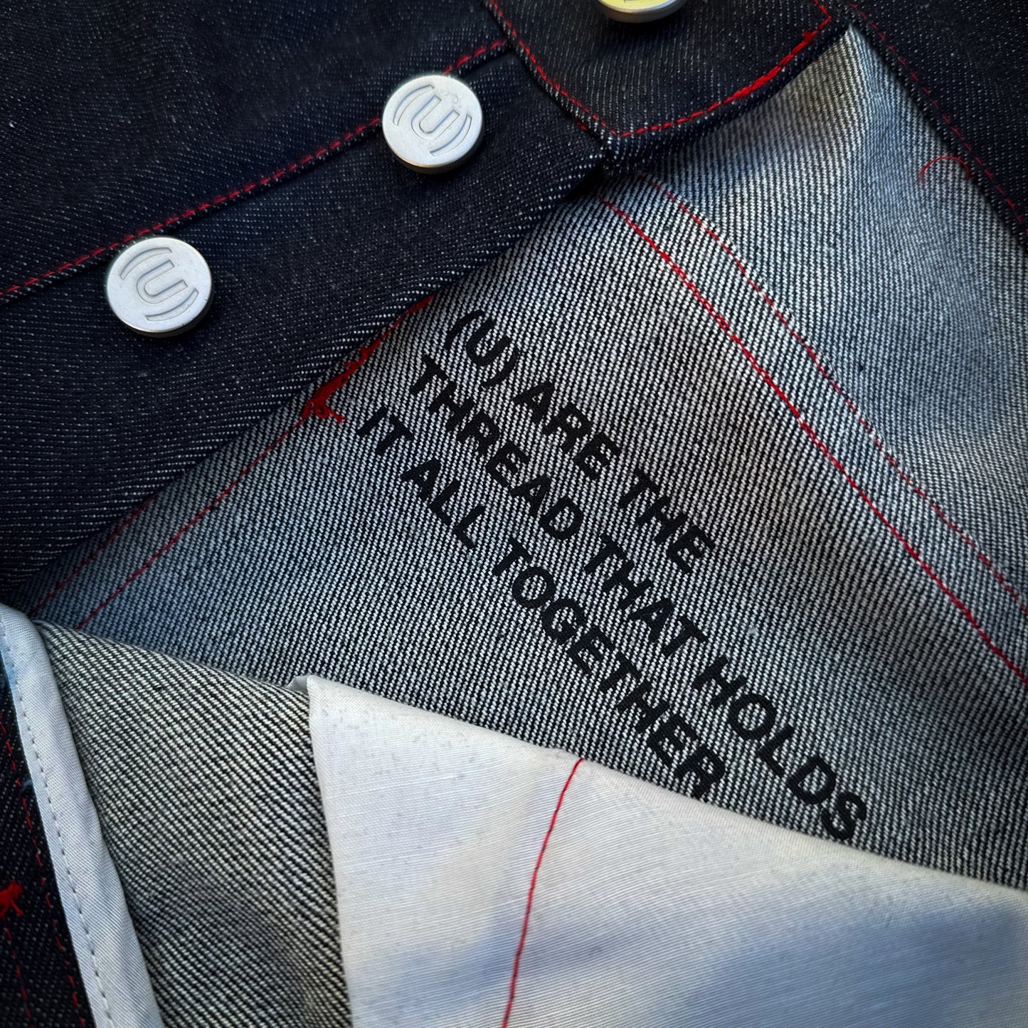 STR(U)NG TOGETHER RAW DENIM JEANS